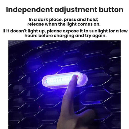 Solar-Powered Car Warning Taillights, Self-Adhesive shown lit on a grille with finger pressing independent adjustment button