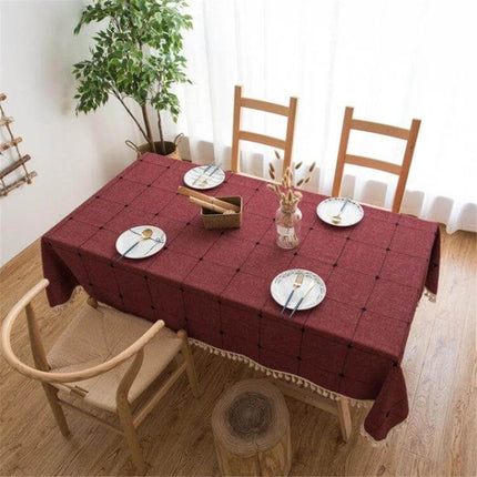 Square Lattice Embroidered Tablecloth, Tassel Border - burgundy cotton tablecloth on dining table with tasseled edges and square lattice embroidery