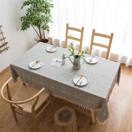 Square Lattice Embroidered Tablecloth, Tassel Border on dining table with neutral linen-style cotton and tasseled edges