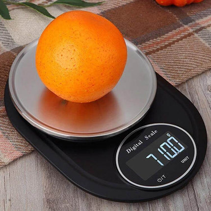 Stainless Steel Kitchen Scale For Everyday Home Use - compact digital scale with 13cm pan weighing an orange, precise tare and multiple units