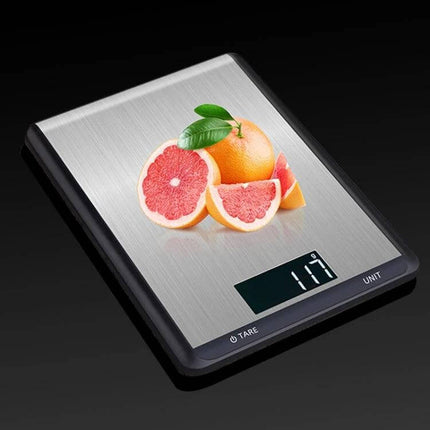 Stainless Steel Kitchen Scale With Large Pan For Everyday Baking shown with grapefruit on large stainless pan and backlit LCD display