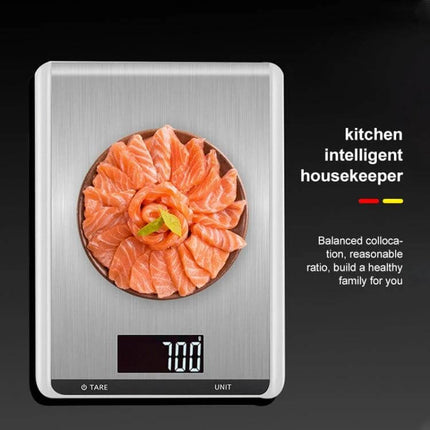 Stainless Steel Kitchen Scale With Large Pan For Everyday Baking on black background showing salmon slices and backlit LCD reading 700 g