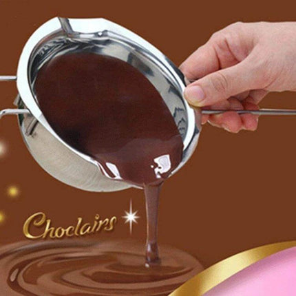 Stainless Steel Chocolate Melting Pot For DIY Baking - hand holding stainless double-boiler liner pouring melted chocolate