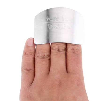 Stainless Steel Finger Guard For Safe Vegetable Cutting worn on fingers to protect while slicing carrots onions peppers