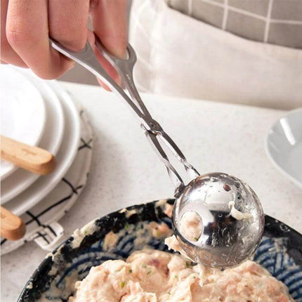 Stainless Steel Meatball Maker Clip For Easy Home Meals - hand using mirror-polished stainless scoop to form uniform meatballs over bowl