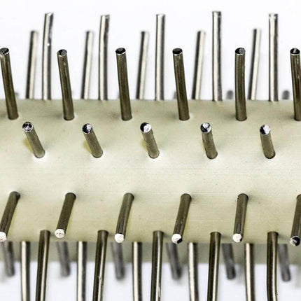 Stainless Steel Rolling Pin With Wooden Handle For Pizza And Snacks close-up of stainless steel barrel with metal spikes for dough aeration