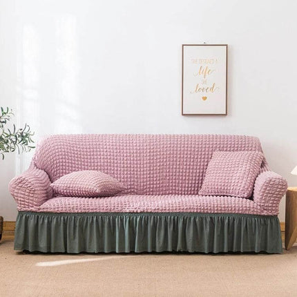 Stretch Sofa Cover With Skirt for Double M 145-185cm Sofas in pink seersucker fabric with lotus-leaf bottom skirt and straps protecting sofa