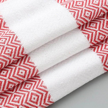 Striped Cotton Bath Towel With Tassels For Everyday Use - folded red-and-white striped cotton-linen towel with geometric pattern, 100x180 cm