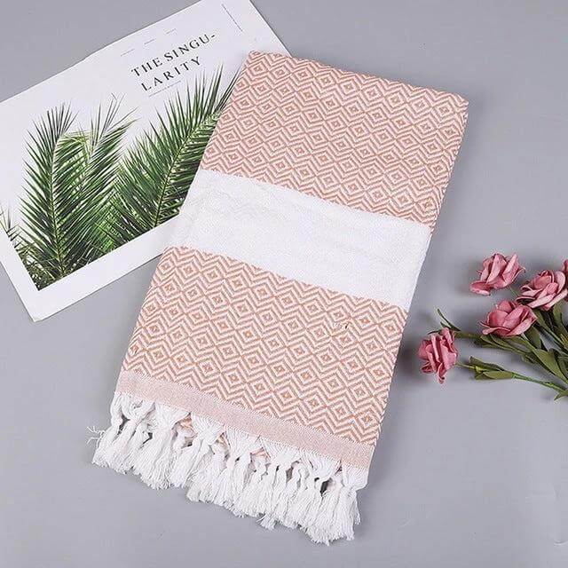 Striped Cotton Bath Towel With Tassels For Everyday Use folded pink geometric cotton-linen towel with white band and tassels, 100x180 cm, versatile