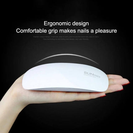 Sun Mini Nail Lamp For Gel Nails Compact For Home Use - white ergonomic folding LED gel nail lamp shown in hand