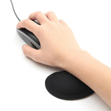 Ergonomic Mouse Pad with Comfortable Wrist Rest for Daily Computing shown with hand using wired mouse on black 3D silica gel memory foam wrist support