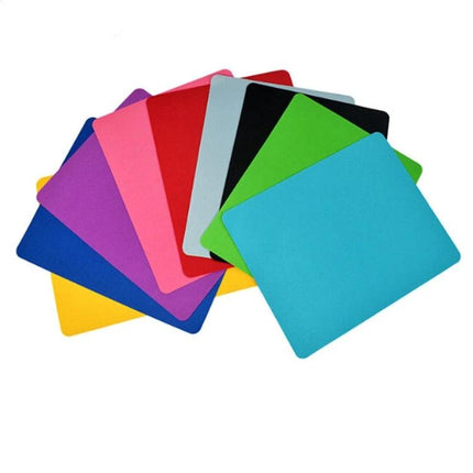 Solid Color Anti-Slip Mouse Pad with Wrist Rest for Office Use showing assorted solid-color cloth and rubber mouse pads with wrist rest option