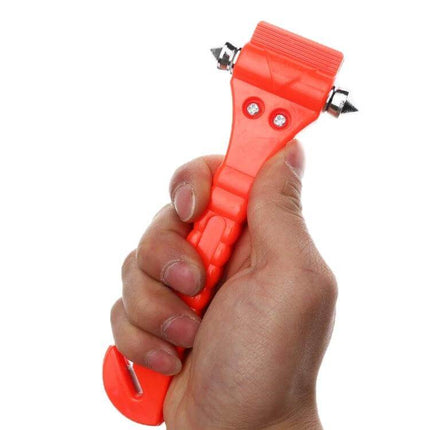 Mini 2-in-1 Car Emergency Hammer for Glass Breaking and Seat Belt Cutting in hand, red compact glass breaker and seatbelt cutter