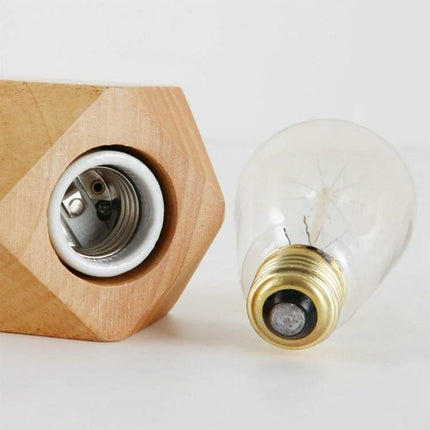 Minimalist Wooden Table Lamp for Your Bedroom Nightstand showing wooden socket and vintage bulb on bedside table