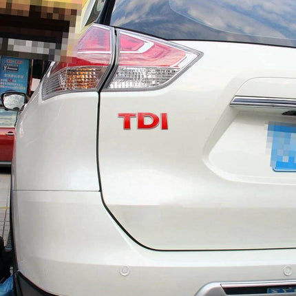 TDI 3D Badge Emblem Car Decal Sticker for Vehicle Decoration on white SUV rear panel, red raised TDI letters applied near taillight