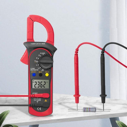 ANENG Digital Clamp Multimeter for AC and DC Measurements showing clamp meter measuring resistor with red and black probes on countertop