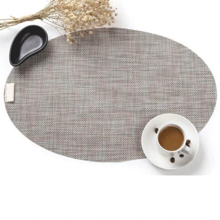 Oval Silicone Placemats Non Slip For Dining Table Decor - Grey oval silicone placemat with coffee cup and dish on table