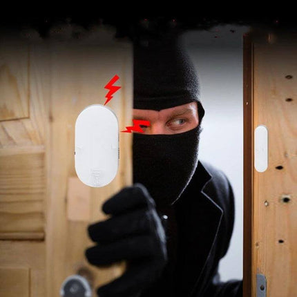 Door and Window Security Alarm for Home Entry Protection detecting intruder at a partially opened door, compact alarm attached to frame