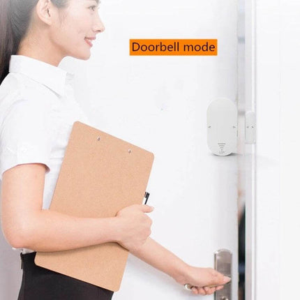 Door and Window Security Alarm for Home Entry Protection mounted on doorframe in doorbell mode alerting when door opens
