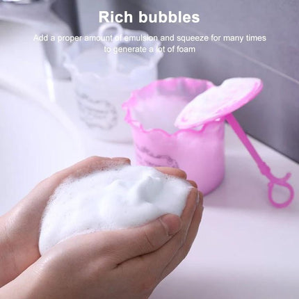 Compact Facial Foamer for Everyday Skin Cleansing Routine - hands holding rich foam with pink foaming cup and spatula