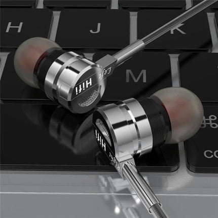 Wired Earphones With Ear Hook Fit And Inline Mic For Commute sleek metal earbuds on keyboard for travel and workouts