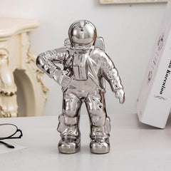 Jarrón de cerámica con flores secas y diseño de astronauta para decoración de mesa