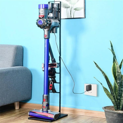 Dyson Vacuum Cleaner Wall-Mounted Storage Bracket Solution showing cordless Dyson secured on a slim black wall stand with accessories