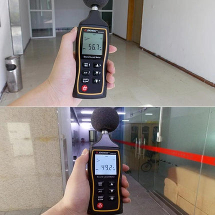 SNDWAY Handheld Noise Decibel Meter for Sound Level Monitoring held in hand measuring indoor office noise levels