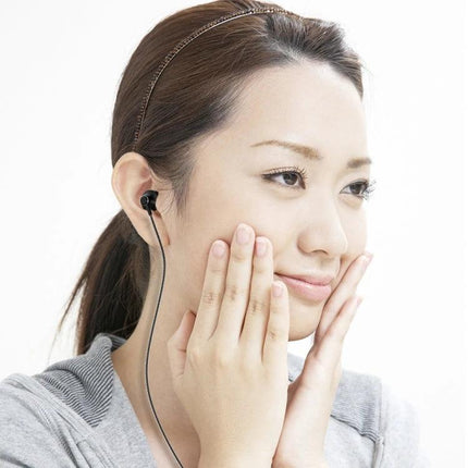 PTM Wired Earphones With Inline Mic For Calls And Commuting shown worn by woman with 3.5mm jack, inline mic and controls visible