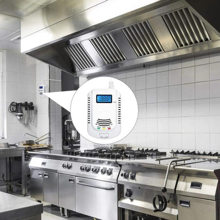 Coalgas Home Gas Leak Detector for Natural and Propane Safety mounted in a commercial kitchen above the stove showing digital display and alert lights