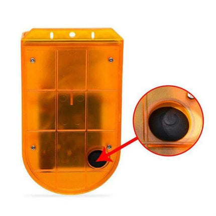 Solar Powered Motion Sensor Alarm Light for Farm Security - orange solar alarm unit with motion sensor and power jack close-up