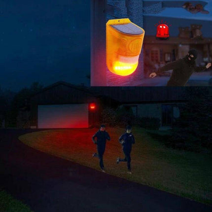 Solar Powered Motion Sensor Alarm Light for Farm Security mounted on barn wall illuminating driveway and deterring intruders at night