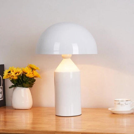 Metal Mushroom Table Lamp for Bedroom and Study Lighting on wooden nightstand with soft warm glow, white metal mushroom design