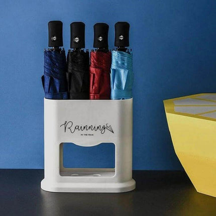 Four-Hole Umbrella Storage Rack for Home Entrance Organization holding four folded umbrellas to keep wet umbrellas contained