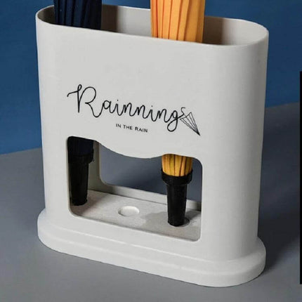 Four-Hole Umbrella Storage Rack for Home Entrance Organization white modern umbrella holder catching water from wet umbrellas