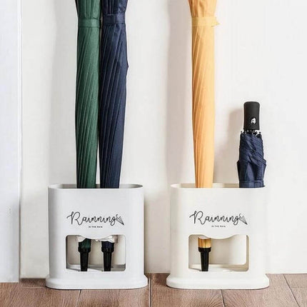 Four-Hole Umbrella Storage Rack for Home Entrance Organization holding wet umbrellas neatly by the door