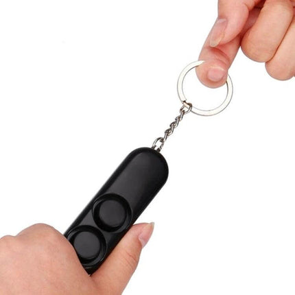 Compact Personal Security Alarm Keychain for Everyday Safety - compact black keychain alarm held by two hands, loud emergency siren for walking alone