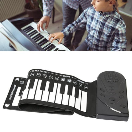 Compact Rollable Piano for Children's Daily Music Practice - 49-key portable roll-up keyboard shown unrolled with speaker, ideal for kids' home or travel practice