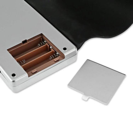 Compact Rollable Piano for Children's Daily Music Practice showing open battery compartment and removable cover for portable 49-key rollable piano