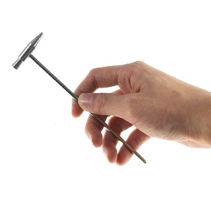 Mini Tuning Hammer for Everyday Instrument Maintenance at Home - hand holding compact metal tuning hammer for piano and kalimba