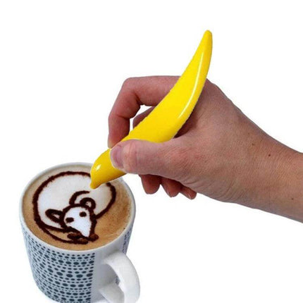 Electric Latte Art Pen for Coffee and Cake Decorating creating mouse latte art with yellow pen over cappuccino