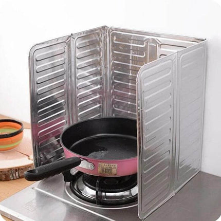Oil-Proof Cooktop Shield 84x32.5 cm Kitchen Splash Guard displayed folded around a frying pan to block oil splatter on backsplash