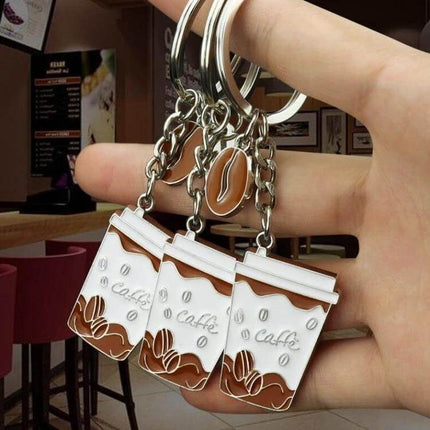 2 Pack Coffee Cup Keychains for Keys and Bags, Ideal Gift - zinc alloy textured finish coffee cup keychains shown on hand, perfect for keys and bags