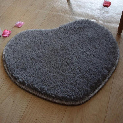 Soft Heart-Shaped Mat for Home Kitchen and Bathroom Floors gray coral fleece mat placed on wood floor in front of sink