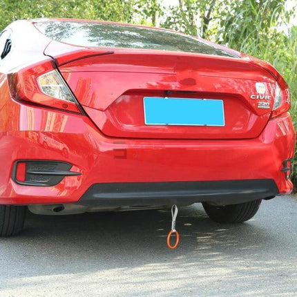 Heart-Shaped Car Decorative Warning Ring for Protection and Safety hung from rear bumper as a visible parking and safety reminder