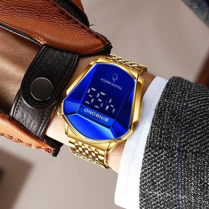 BINBOND Men's Touch Screen Steel Band Watch for Everyday Use on wrist showing blue digital face, gold steel band, luminous digits and calendar