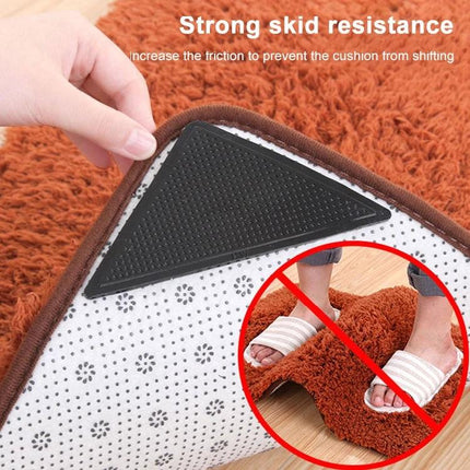 Non-Slip Stickers for Safer Bathroom Floors at Home shown on rug corner, black triangular anti-slip pad preventing sliding and bunching