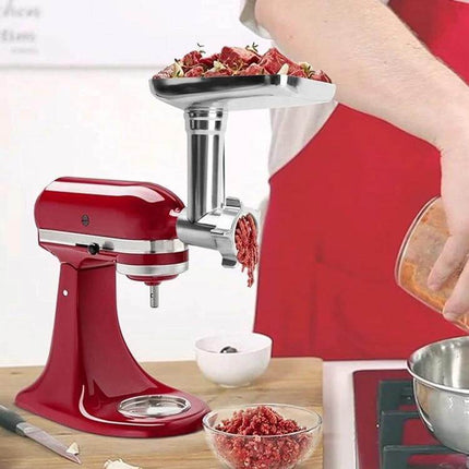 All Metal Meat Grinder Attachment Set for Stand Mixers attached to red stand mixer grinding beef into bowl