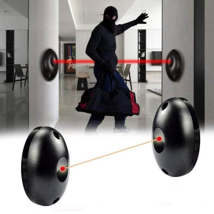 Single Beam Infrared Detector for Security and Doors mounted at doorway emitting red beam to detect intruder
