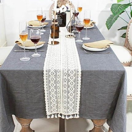 Tassel Lace Floral Table Runner Crochet Cotton Blend 24x180cm on gray dining table with wine glasses and center decor